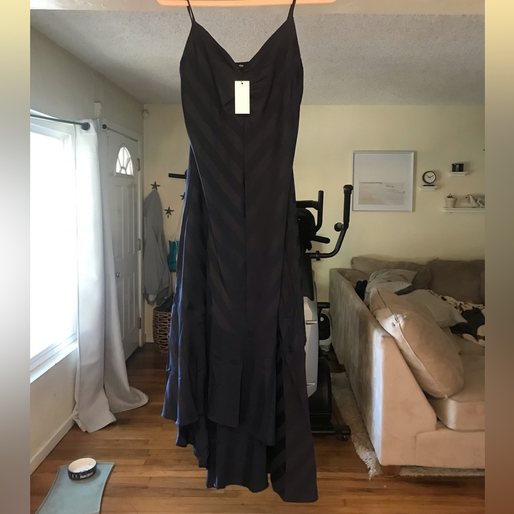 Vici sold navy wedding guest dress. Medium. Loose fitting. High low hem.